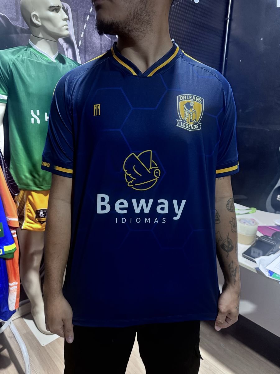Camisa de futebol azul e dourada do Orleans Legends com escudo bordado